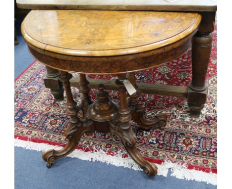 A Victorian walnut demi lune card table W.93cm