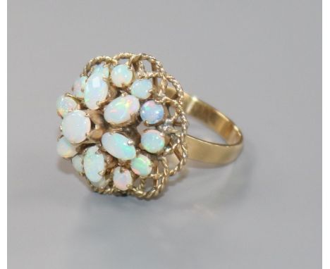 A modern 18ct gold and opal cluster dress ring, size M.