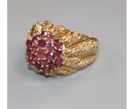 A modern 9ct gold and ruby cluster dress ring, size S.