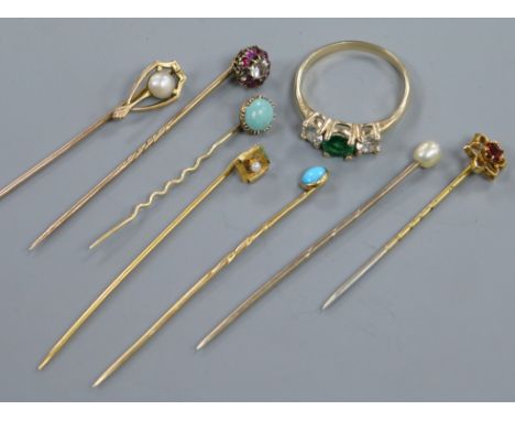 A 585 yellow metal ring and seven assorted stick pins including one 10ct.