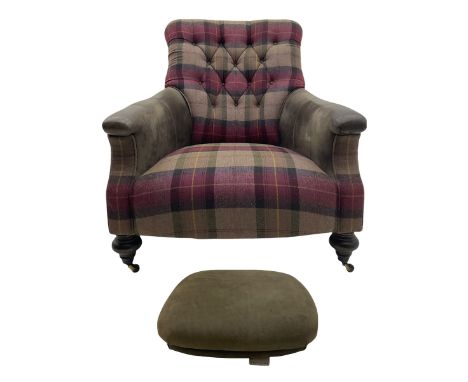John Sankey - low armchair, buttoned back upholstered in tartan patterned fabric with contrasting grey leather, raised on tur