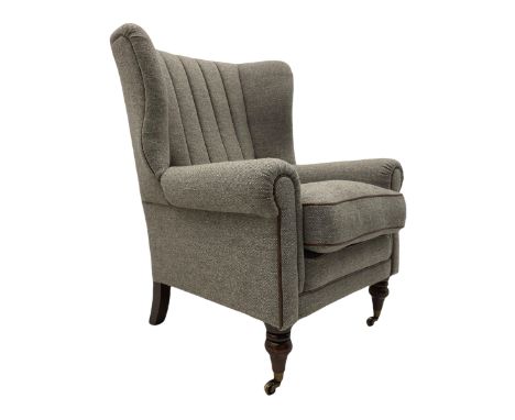 Harris Tweed - "Dunmore" wingback armchair upholstered in "Heather" wool fabric with brown piping, turned front supports with