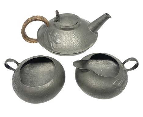 Archibald Knox for Liberty &amp; Co Tudric pewter three piece tea service, comprising teapot with woven reed handle, single h