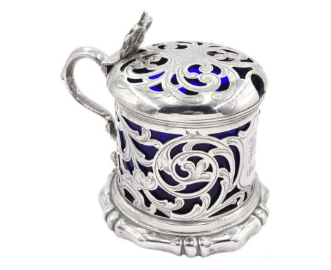 Victorian silver mustard pot, of drum form with scroll handle and scrolling foliate pierced decoration, the body with cartouc