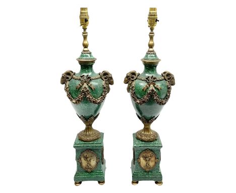 Pair of Neo-Classical style malachite effect table lamps, the urn shaped bodies with applied bronzed ram masks, and ribbon an