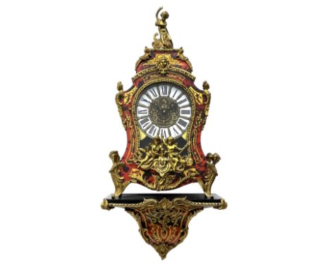 Contemporary Italian Boulle clock with a conforming wall bracket in simulated tortoise shell and brass inlay, case and bracke