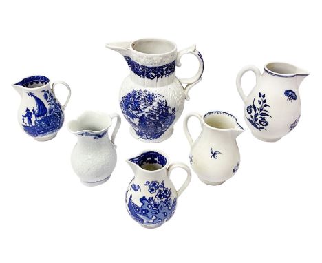 Four 18th century Worcester porcelain jugs, comprising three sparrow beak examples, the first example decorated in the Bat or