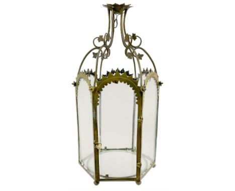 19th century brass and clear glass hexagonal hall lantern, with scrolling wire work open domed top over six arched panels, in