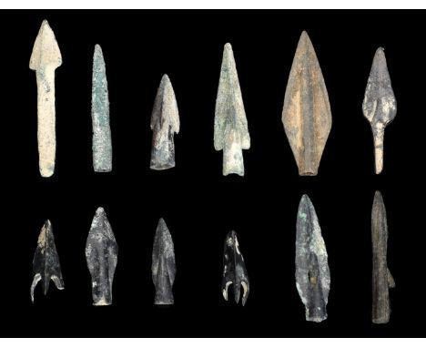 Greek, bronze Arrowheads (12), 4th-3rd cent. BC, socketed and tanged with ribbed heads and barbs [12]. All intact £60-£80  --