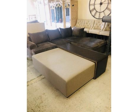 A large square light grey upholstered footstool/coffee table with leather bench with brass stud detailing (W151cm D151cm H45c
