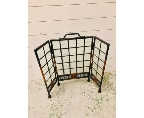 A Copper and leaded bevelled glass fire surround on four feet in art deco style