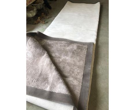 An extra large rectangular light grey rug with trim (575cm X 554cm)