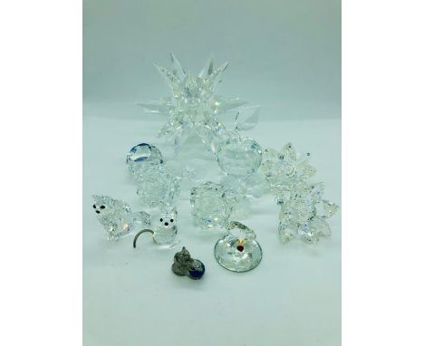 A Selection of crystal glass ornaments to include a starburst candlestick