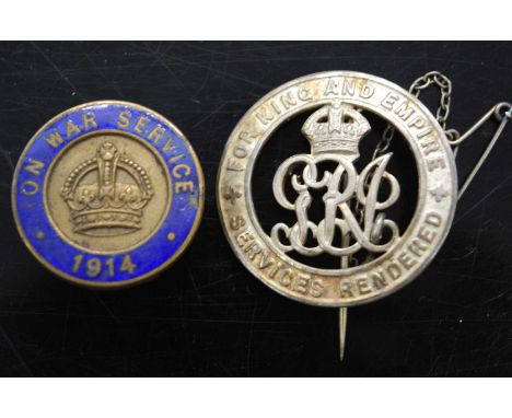 A WW I Silver War Badge, numbered verso B173833, together with an On War Service lapel badge no. CO 44384, a Scottish silver 