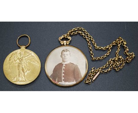 A WW I Victory medal, naming 6926 PTE. F.M.B. WARREN. 18-LOND. R., together with a locket with portrait (presumably) of Pte W