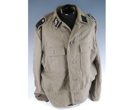 A German SS tunic, with collar tabs, epaulettes and arm badge, the front with pebbled buttons and two breast pockets, with tw