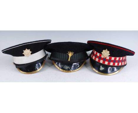 A British Army Scots Guards peaked cap, together with two others for the Coldstream Guards and Welsh Guards. (3)