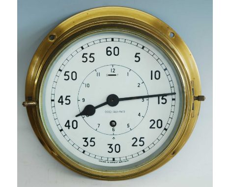 A 20th century brass cased Naval bulkhead clock, the circular enamel dial with outer minute and inner hour scale with Arabic 