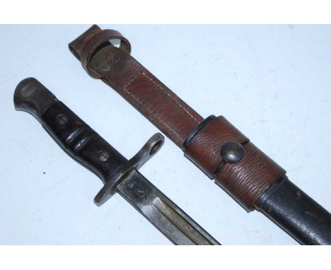 A 1913 pattern Remington bayonet, the 43cm single edged fullered blade stamped to the ricasso 1913, 9 17 Remington and US to 