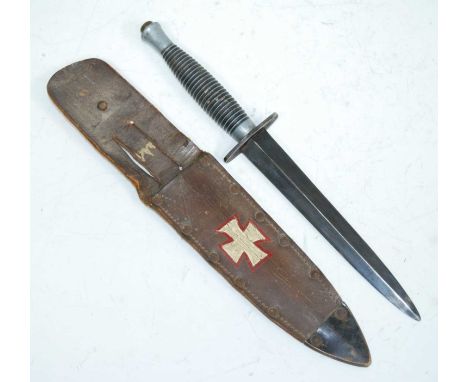 A British Fairbairn-Sykes 3rd Pattern Commando fighting knife, having a 17cm double edged spear-point blade, the oval crossgu