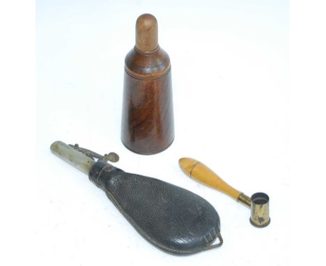 A 19th century leather shot flask, of typical pear shpe, the plated nozzle with measure for 1 and 1 1/4oz, 22cm, together wit