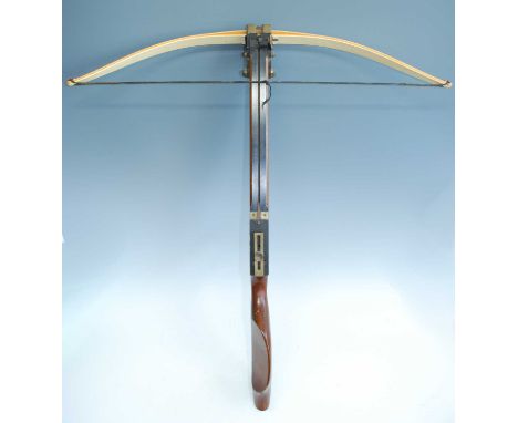 A crossbow, the laminated bow marked Border Archery Mellerstain Gordon Scotland, 27647, with brass lion mask fitting, folding