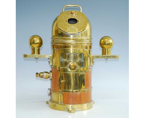 A "Faithful Freddie" brass cased submarine binnacle, the domed cover with two opposing hinged observation windows opening to 