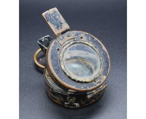 A WW II Verner's Pattern Mk III brass cased compass, having a mother of pearl scale and stamped verso T.G. Co. Ltd London No.