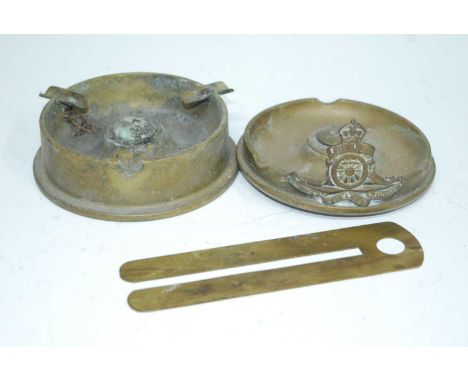 A WW II trench art ashtray with applied Royal Artillery badge, made from a 3.7" Howitzer II shell dated 1941, together with o