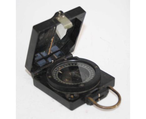 A British military issue magnetic marching compass Mk I, no. B38305, maker T.G. Co. Ltd, 10cm (including suspension ring.)