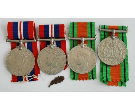 A collection of four WW II medals to include Defence x2 and War x2, together with a The Wakefield R.A.F. Boxing Trophy silver