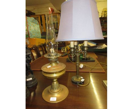 Brass three branch table lamp base on circular marble base, together with a brass oil lamp with clear glass chimney