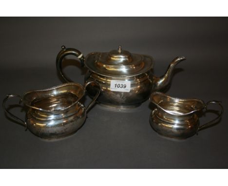Birmingham silver three piece tea service of oval baluster form