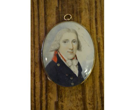 19th Century oval miniature watercolour portrait of a gentleman with blue tunic, signed with monogram J.B., housed in a gilt 