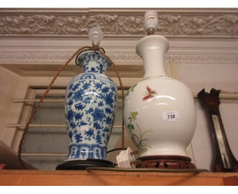 Chinese blue and white baluster form lamp base with shade, together with another porcelain lamp base having floral and insect