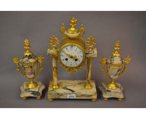 19th Century French gilt brass and flecked white marble three piece clock garniture, the enamel dial with Arabic numerals and