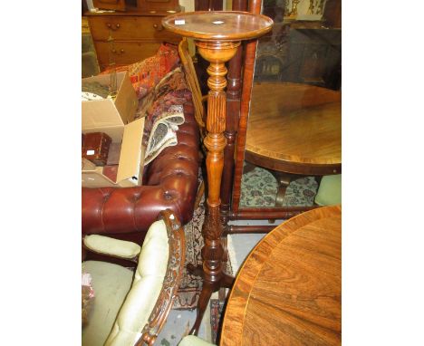Carved and turned mahogany torchère with dish top and tripod base