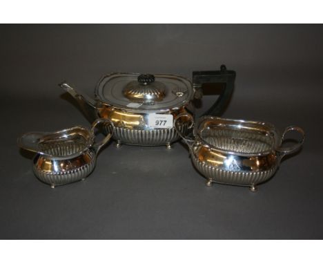 London silver three piece tea service having half gadroon decoration with ebony finial and handle