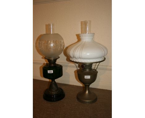 Late 19th / early 20th Century oil lamp having green glass well and etched shade, together with another oil lamp with opaque 