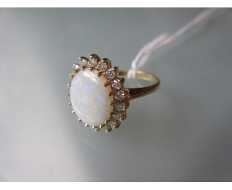 14ct Yellow gold oval opal and diamond cluster ring