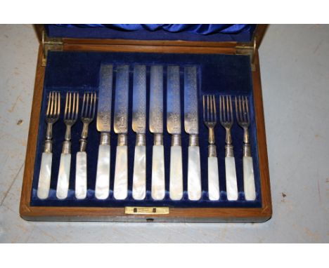 Victorian oak cased set of six silver bladed dessert knives and forks with mother of pearl handles, Sheffield 1889