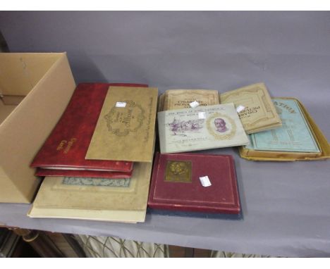 Various individual albums of original cigarette cards, a boxed unopened twin pack of playing cards and a small album of stamp