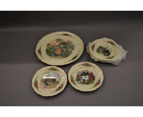 Sarreguemines pottery seven piece serving set decorated with various cottages