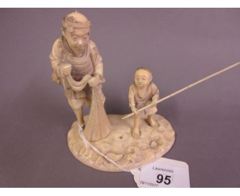 Japanese Meiji period carved ivory okimono group of father and son with fishing net and rod (minor damage and loss), signed w