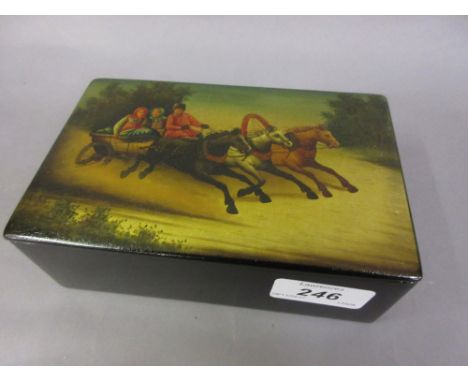 Russian rectangular papier mache cigarette box, the cover painted with a troika scene with factory stamp to the inside cover