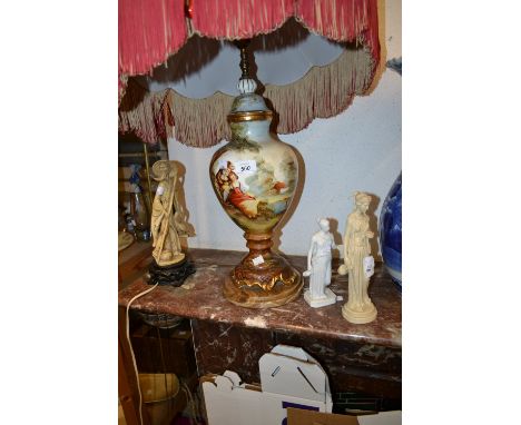 Continental porcelain lamp base, hand painted with figures in a landscape together with a resin figure of a maiden, a bisque 