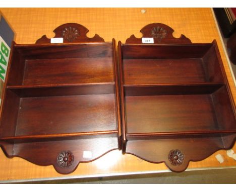 Two small reproduction mahogany three shelf wall brackets