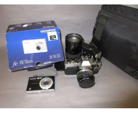 Olympus OM10 35mm camera with 200mm telephoto lens in a soft case together with an Olympus FE3000 digital camera