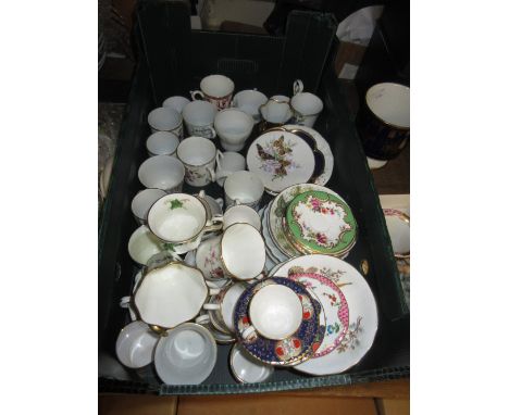 Collection of miscellaneous miniature tea cups with saucers on a wall bracket together with a quantity of other miscellaneous
