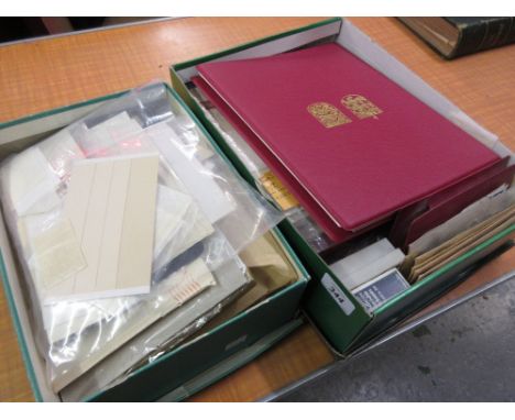 Two boxes containing a collection of various albums of stamps, including Stanley Gibbons album of Channel Islands First Day c